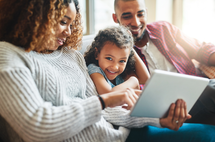 family looking at computer